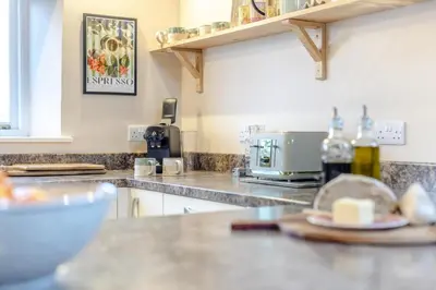 a kitchen with a counter top with a microwave at 3 Bed in Lyonshall oc-h34806 in Lyonshall