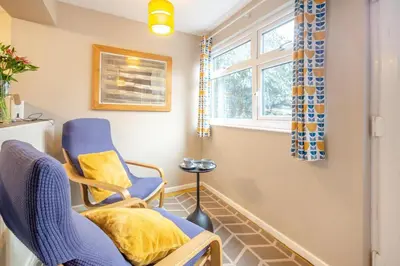 a room with a chair and a window at 2 Bed in Trawsfynydd oc-t34148 in Trawsfynydd
