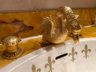 a statue of two swans in a bath tub at Baskerville Hall Hotel in Clyro