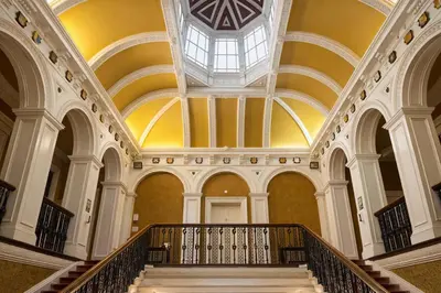 a spiral staircase in a building with a skylight at Baskerville Hall Hotel in Clyro