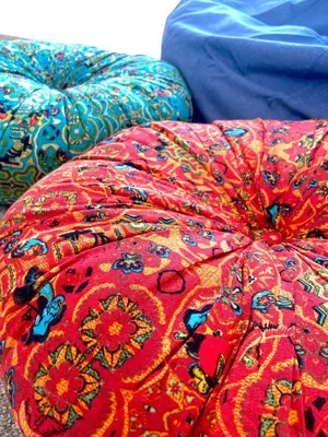 a colorful comforter on top of a bed at Harbour View in Aberaeron