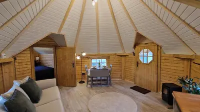 a room with a couch and a table in a house at Oak Hill Escape in Welshpool