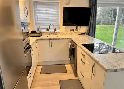 a kitchen with a sink and a counter top at Pet friendly 3 bed retreat for beach, castle, golf in Harlech