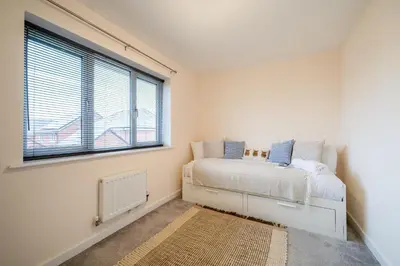 a bedroom with a bed and a window at Cosy & Contemporary 2 Bed Home, Quiet Area Parking - Pass the Keys in Shrewsbury