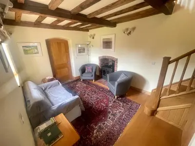 an overhead view of a living room with a couch and chairs at Cosy Cottage with Log Fire Near Hay-on-Wye in Almeley