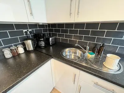 a kitchen with a sink and a counter top at Arenig Cottage, a Snowdonia retreat near Lake Bala in Bala