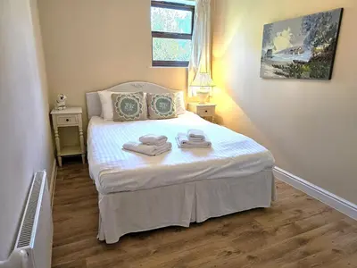 a bedroom with a bed with towels on it at Ever popular 2 bedroom riverside home - to sleep 4 - Pass the Keys in Shrewsbury