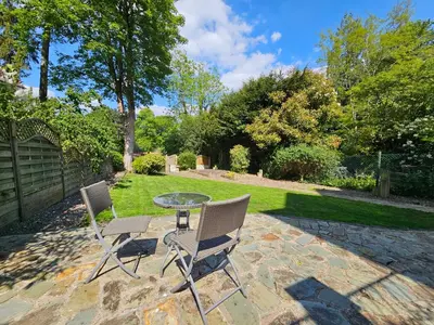 a patio with two chairs and a glass table at Ever popular 2 bedroom riverside home - to sleep 4 - Pass the Keys in Shrewsbury