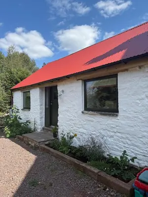 a small white house with a red roof at Y Beudy - A Converted Barn in the Brecon Beacons in Brecon