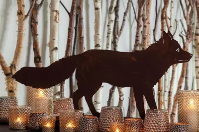 a statue of a moose standing on top of candles at Foyles of Glasbury in Glasbury