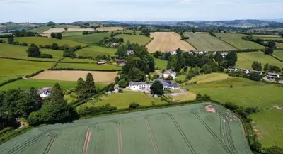 an aerial view of a house in a field at Brynderwen Barn in Llangorse