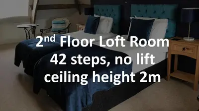 a bedroom with a bed with a floor loft room steps no lift at Aberllynfi Riverside Guest House in Glasbury