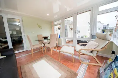a living room with chairs and a table at Talybont B&B Aberystwyth in Talybont