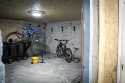 two bikes hanging on a wall in a garage at Mid Wales Holiday Lets, Rhayader in Rhayader