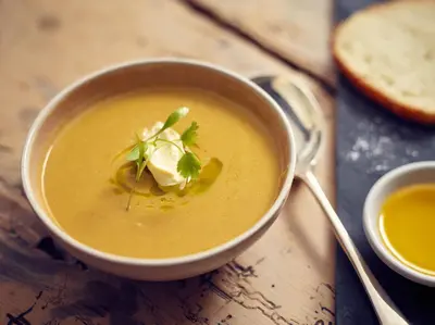 a bowl of soup with a dollop of cream at Riverside Inn, Aymestrey in Aymestrey