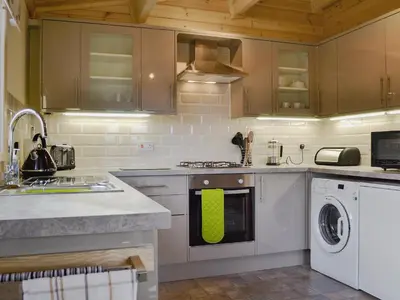 a kitchen with a sink and a dishwasher at Callow Lodge in Meadowtown