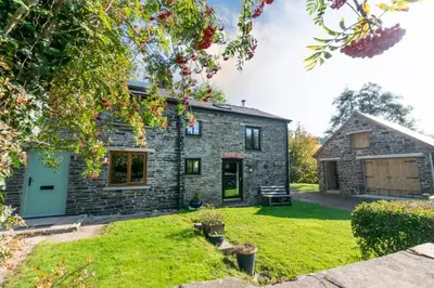 an image of a stone cottage with a yard at 2 Bed in Brecon oc-37318 in Pentre-bâch