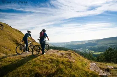 two people standing on a hill with their bikes at 2 Bed in Brecon oc-37318 in Pentre-bâch