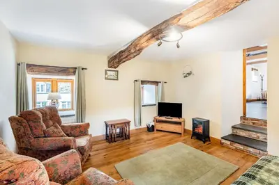 a living room with a couch and a tv at 2 Bed in Bala oc-82768 in Llandderfel