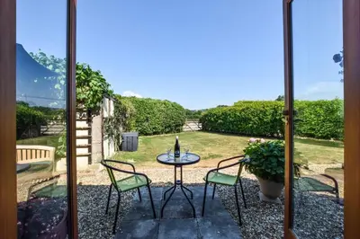 a view of a patio with a table and chairs at 1 Bed in Welshpool oc-75714 in Meifod