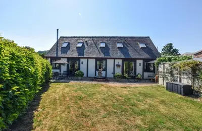 an exterior view of a house with a yard at 1 Bed in Welshpool oc-75714 in Meifod