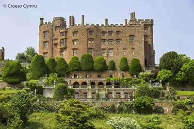an old castle with trees in front of it at 1 Bed in Welshpool oc-75714 in Meifod