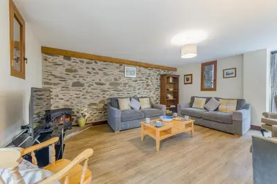 a living room with two couches and a fireplace at 4 Bed in Builth Wells oc-39461 in Builth Wells