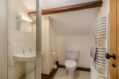 a small bathroom with a toilet and a sink at 4 Bed in Builth Wells oc-39473 in Builth Wells