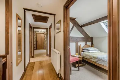 a bedroom with a bed and a mirror at 4 Bed in Builth Wells oc-39473 in Builth Wells
