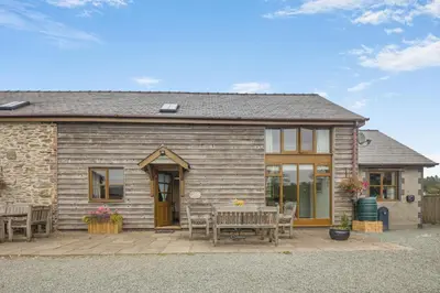 a house with a table and chairs in front of it at 4 Bed in Builth Wells oc-39473 in Builth Wells