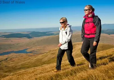 two women walking on top of a hill at Hen Ysgubor in Lampeter