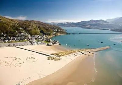 an aerial view of a beach and the ocean at Ysgubor Illtyd in Dolgellau