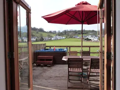 a patio with a table and an umbrella at 2 Bed in Bala oc-82212 in Bala