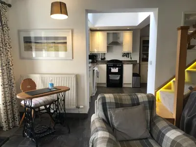 a living room with a couch and a table at Top House in Welshpool