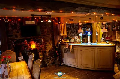a bar in a pub with christmas lights at The Bear Inn in Llandovery