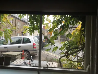 a window view of a car parked on a street at Half Moon House in Hay-on-Wye