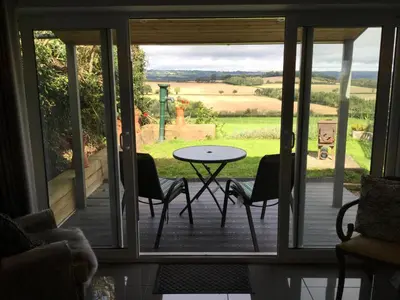 a view of a patio with a table and chairs at The Smithy in Hay-on-Wye
