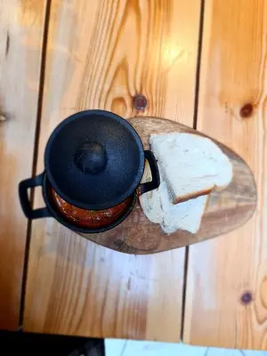 a pot on a cutting board with a piece of cheese at The Albert Hotel in Shrewsbury