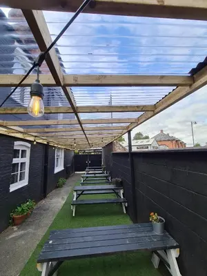 a row of picnic tables on a patio at The Albert Hotel in Shrewsbury