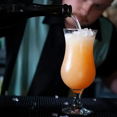 a drink is being poured into a glass at The Albert Hotel in Shrewsbury
