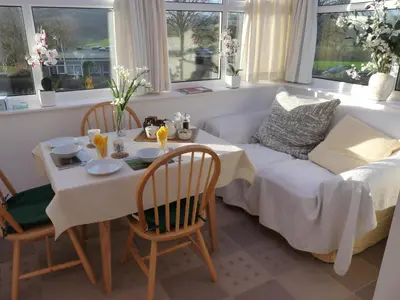 a living room with a table and a couch at Cosy Twin Room in Brecon in Brecon