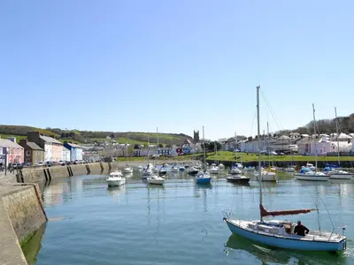 a group of boats docked in a harbor at Tawelfan in Cilcennin