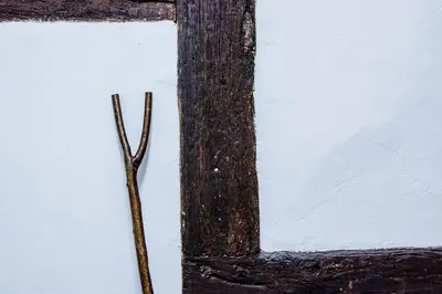 a pair of sticks sitting next to a window at Thursdays Corner Tudor Cottage in Church Stretton