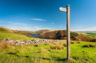 a sign on a pole in a field at Foel Fach in Talerddig
