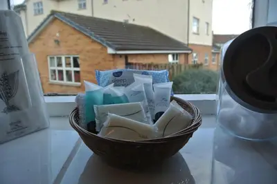 a basket of soap and other items on a table at Old Castle Farm Guest House in Brecon