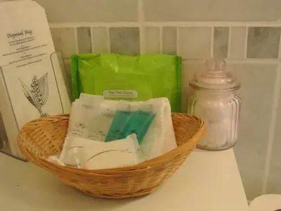 a basket of soap and other items on a counter at Old Castle Farm Guest House in Brecon