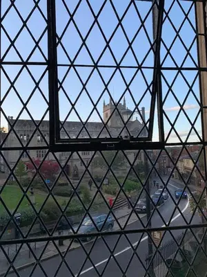 a window with a view of a city with cars at St Nicholas Boutique Hotel in Shrewsbury