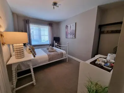 a small bedroom with a bed and a window at Bridge Street in Aberystwyth