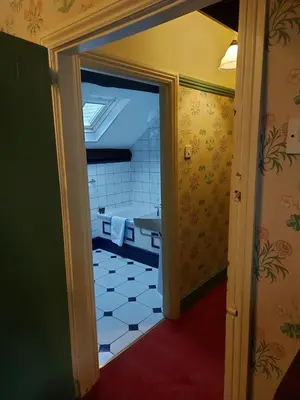 a view of a bathroom with a tub through a door at Bron-Y-Graig in Corwen