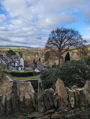 a view of a village from a rock wall at Bron-Y-Graig in Corwen